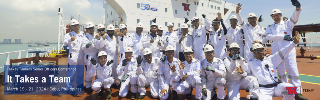 Mix of shore and sea staff in complete PPE on Summit Spirit's Deck, smiling and waving