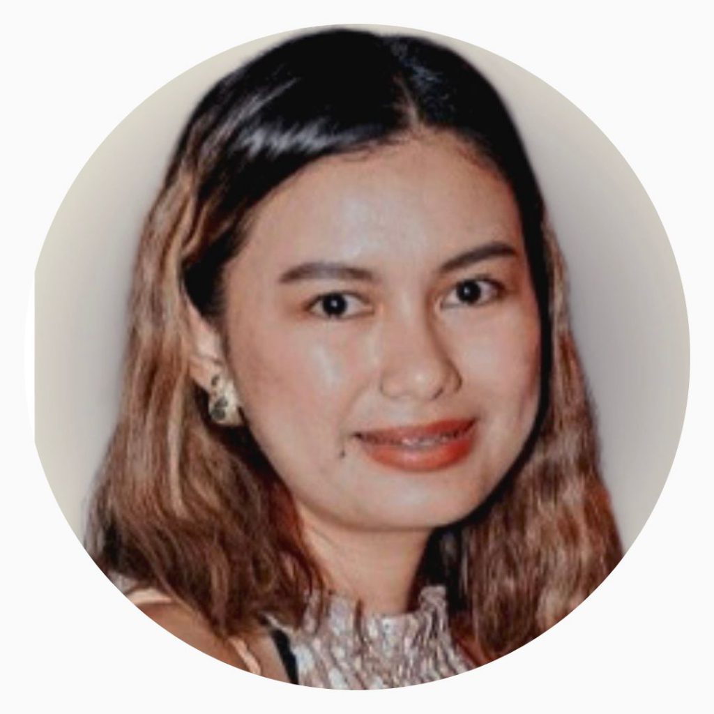 image of Abigail Aznar smiling with gold earings