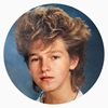 an image of a boy with big hair