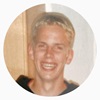 a blond young man smiling